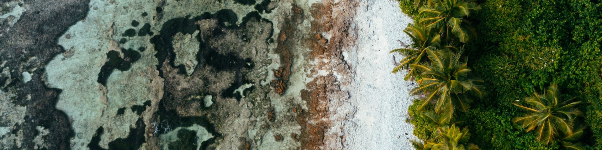 Aerial downshot of the coastline of the tropical Island Fuvahmulah