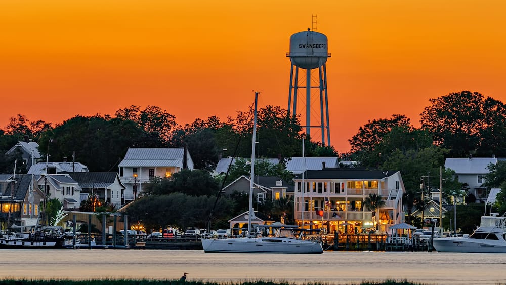 sunset on the waterfront of a city