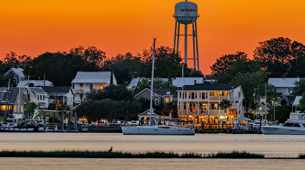 sunset on the waterfront of a city