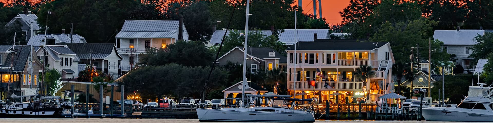 sunset on the waterfront of a city