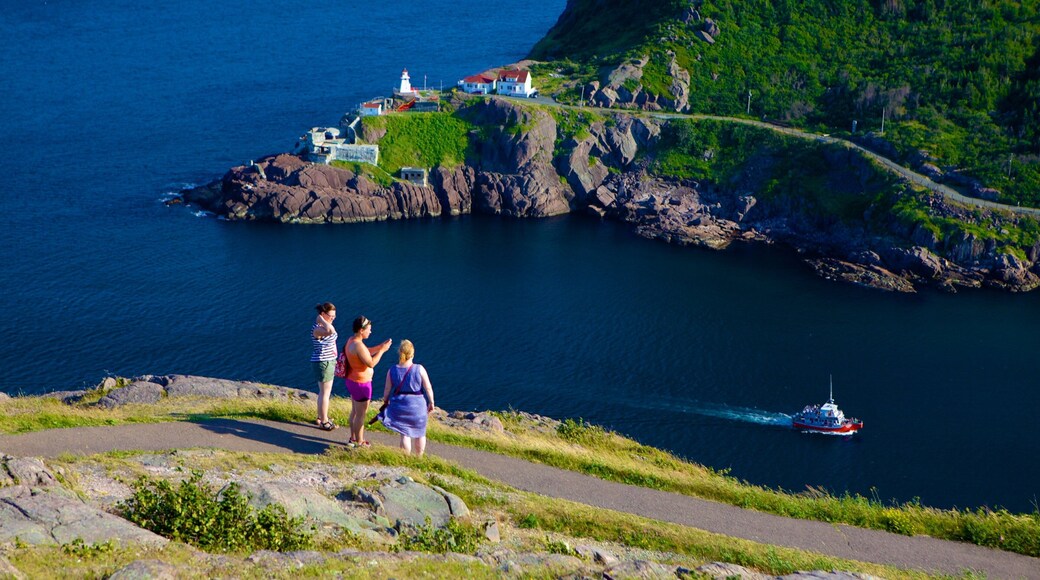 Signal Hill featuring general coastal views as well as a small group of people