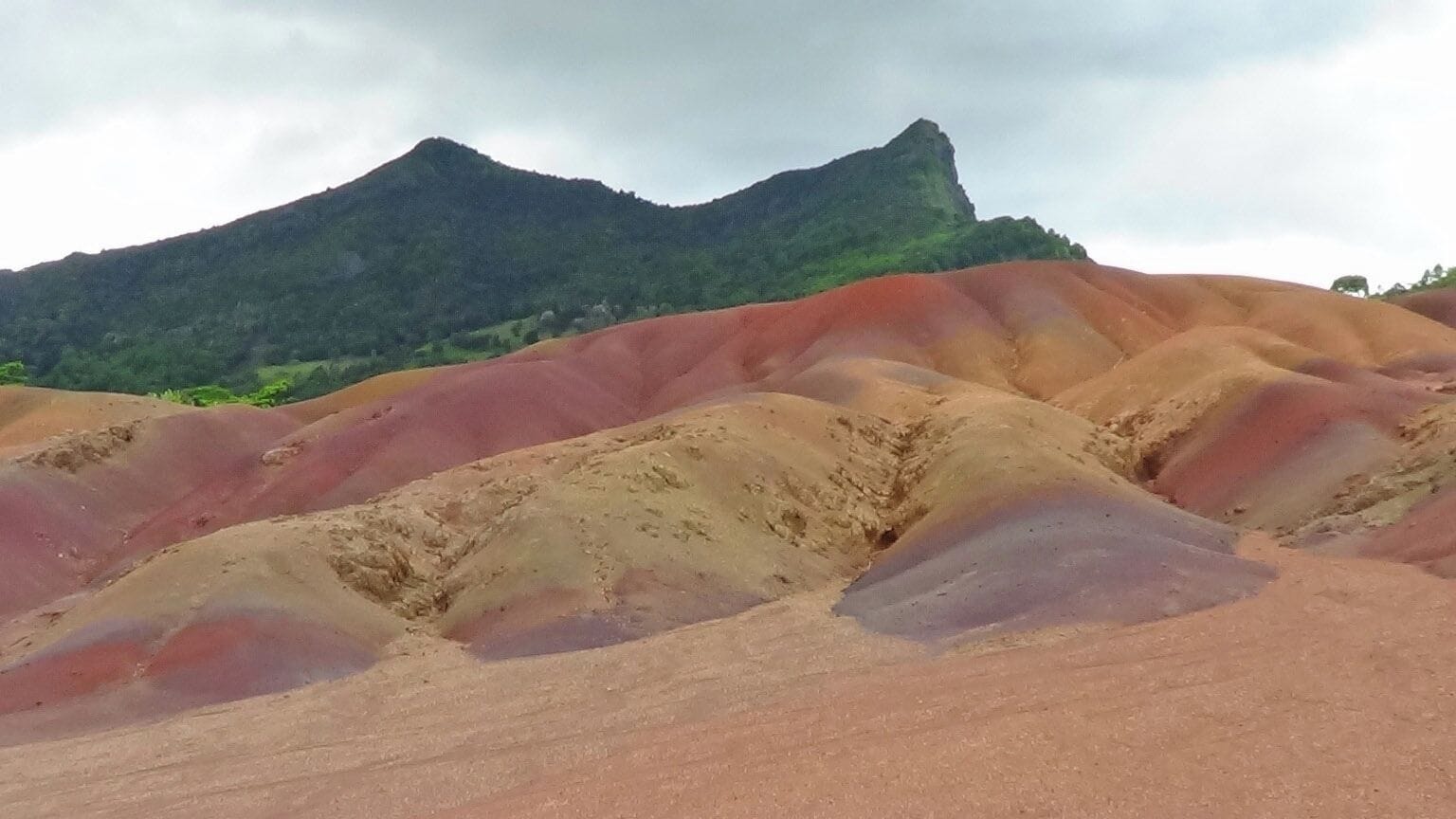Terre des 7 Couleurs is located near Chamarel on the beautiful island of Mauritius. Nearby is the Chameral Waterfall in the Black River Gorges National Park. We had a wonderful lunch at the local rum distilery, La Rhumerie de Chamarel, and tasted some of their rum.