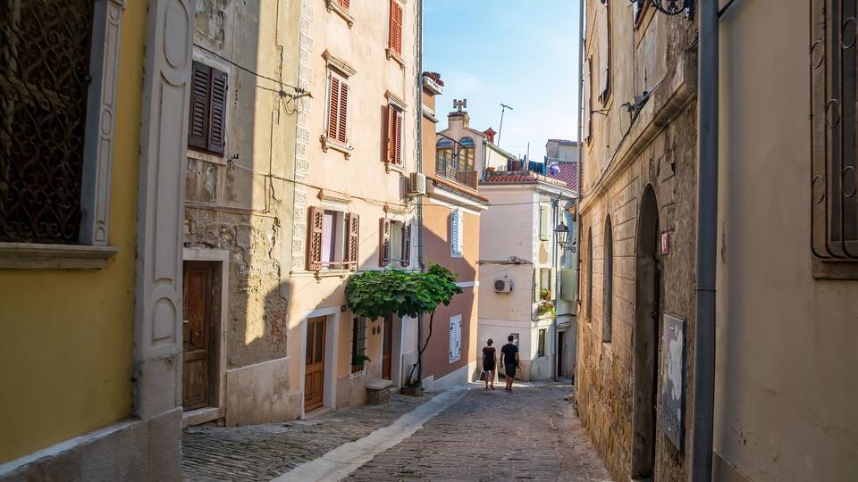 Typical narrow street in historic city of Piran, Slovenia