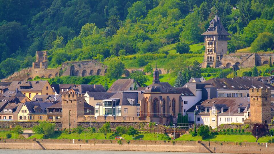 A historic town with medieval architecture, including a church and a tower.