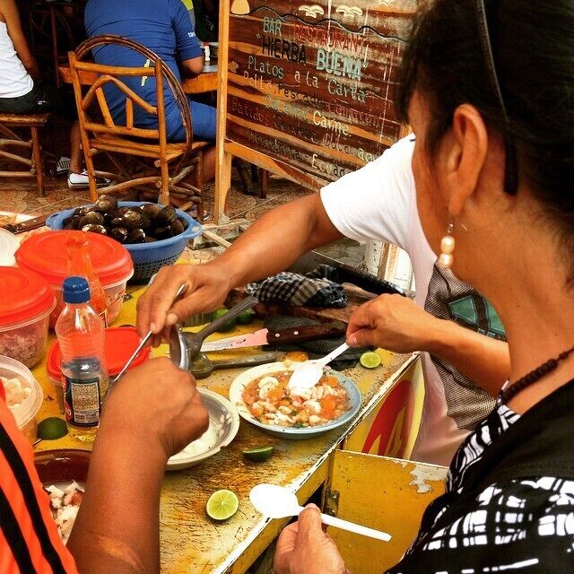 Making ceviche in the streets of Montanita. A whole lot of things went into this to make it taste wonderful! #market