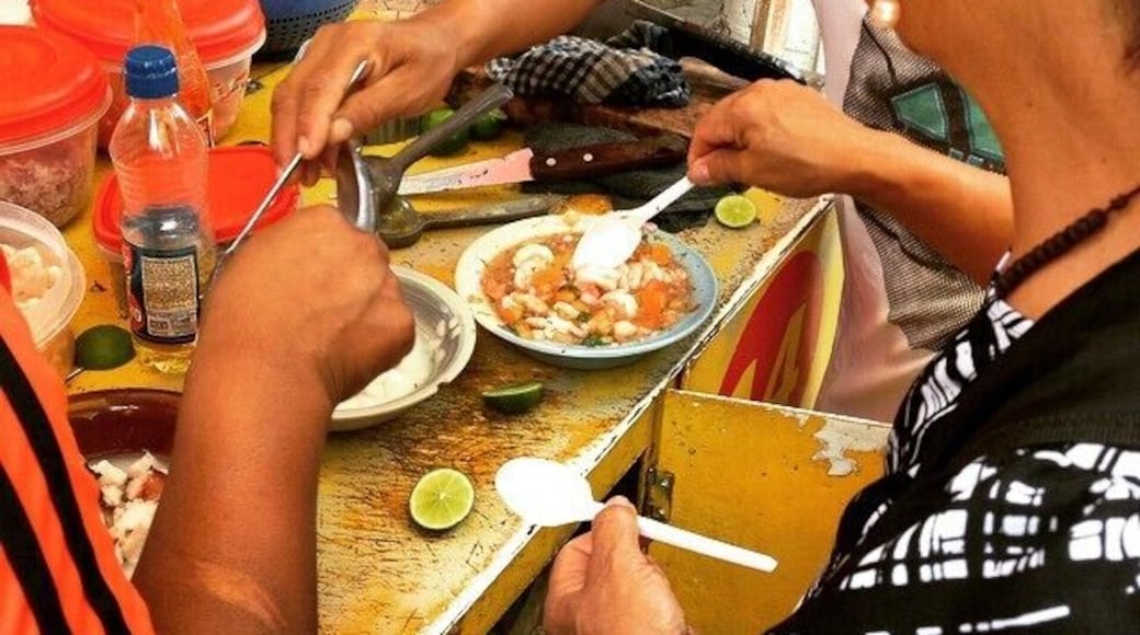 Making ceviche in the streets of Montanita. A whole lot of things went into this to make it taste wonderful! #market