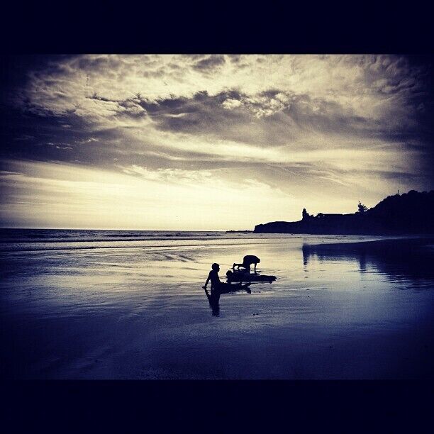 Happy kids rolling in the sands of Montanita, as the sun goes down. A #nofilter photo from the beautiful country of Ecuador!