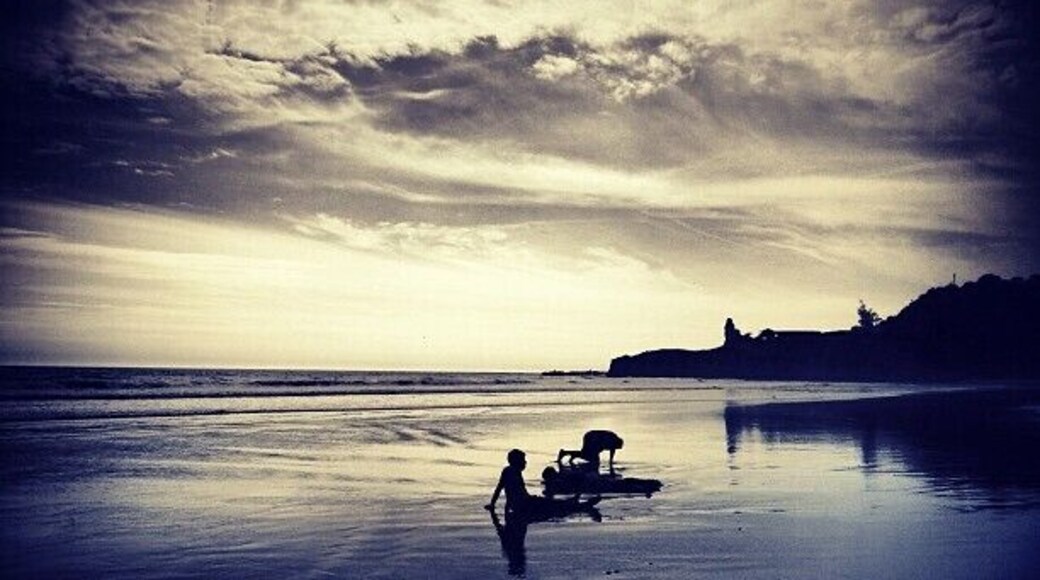 Happy kids rolling in the sands of Montanita, as the sun goes down. A #nofilter photo from the beautiful country of Ecuador!