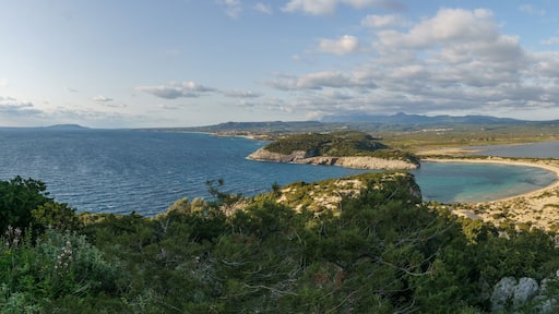Panorama of idyllic voidokilia beach with turquoise colored water from a high point of view on a sunny spring day, Messinia, Peloponnese, Greece