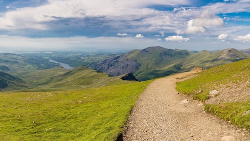 Walking down from Mount Snowdon on the Llanberis Path, Snowdonia, Gwynedd, Wales, UK - looking north towards the Clogwyn station, Llyn Padarn and Llanberis