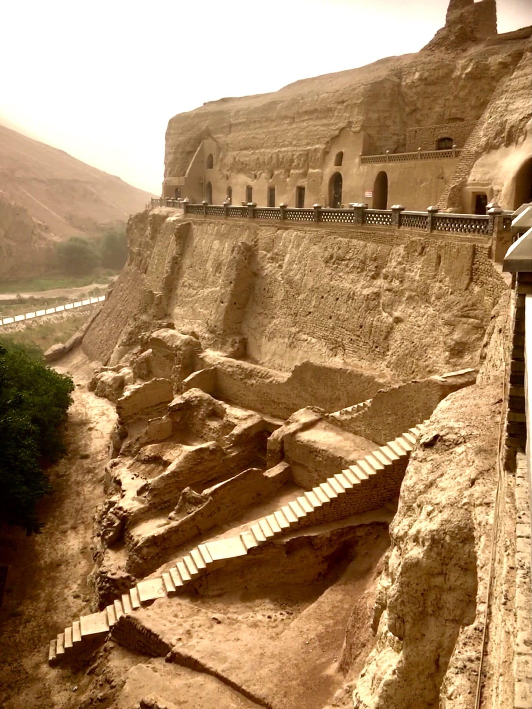 This is the 1000 Buddha caves outside of Turpan, China. It was windy today and a dust sty was blowing up in the area.