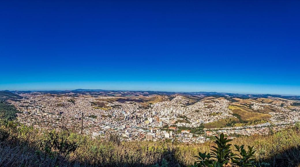 Panoramic photo of the city of Poços de Caldas, Minas Gerais - Brazil - Panoramic photo of the hill of Christ in Pocos de Caldas on a sunny morning with blue sky