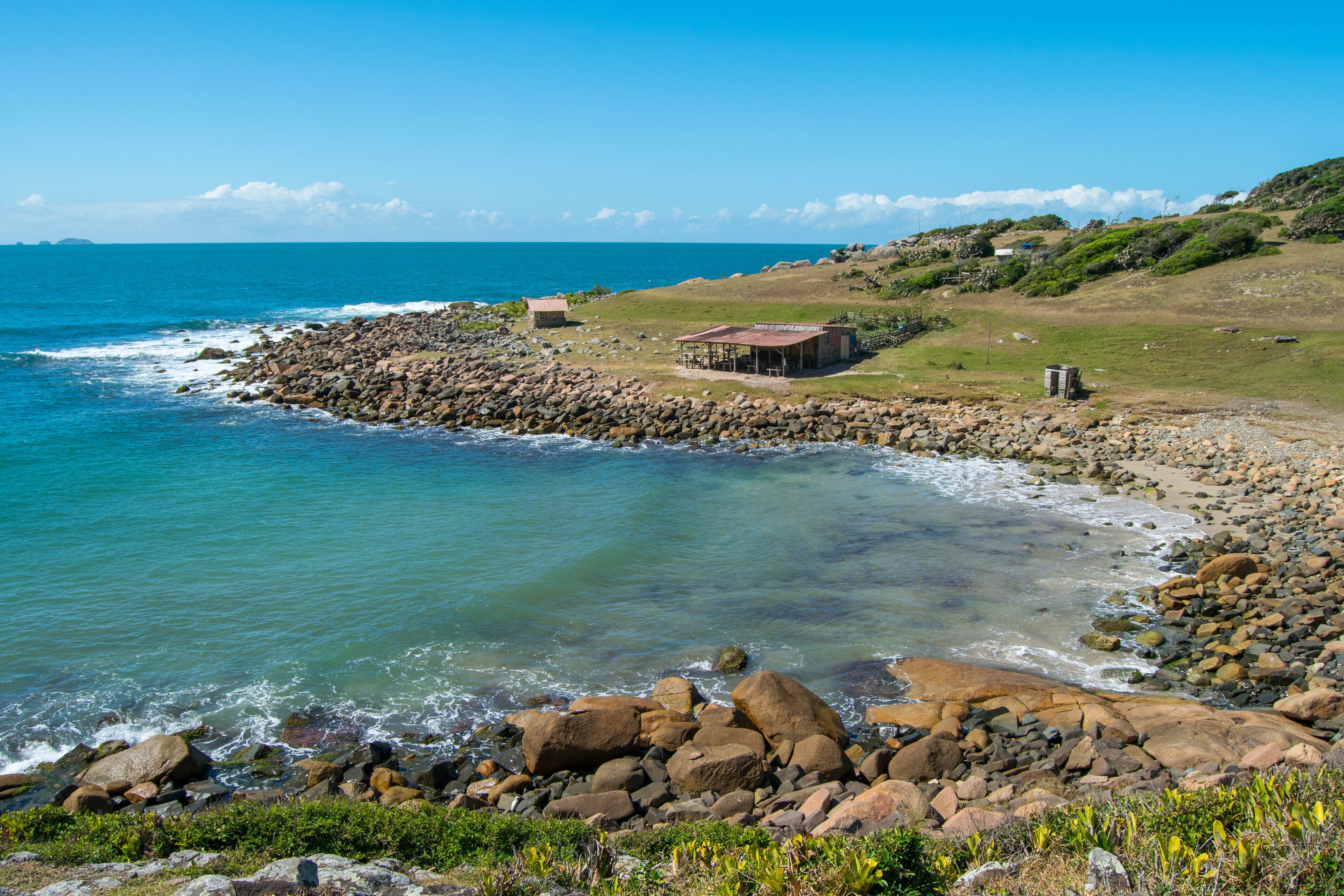 Maço beach, in Palhoça. Beautiful beach among green mountains and rocks in Santa Catarina, Brazil