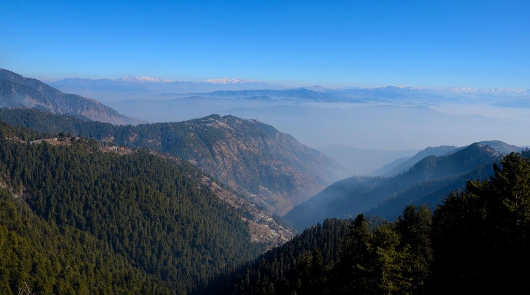 Murree / Nathia Gali, Pakistan - January 12, 2018: A distant view of Himalayan mountain range between the Pakistani towns of Murree and Nathia Gali. Both towns are popular tourist spots.