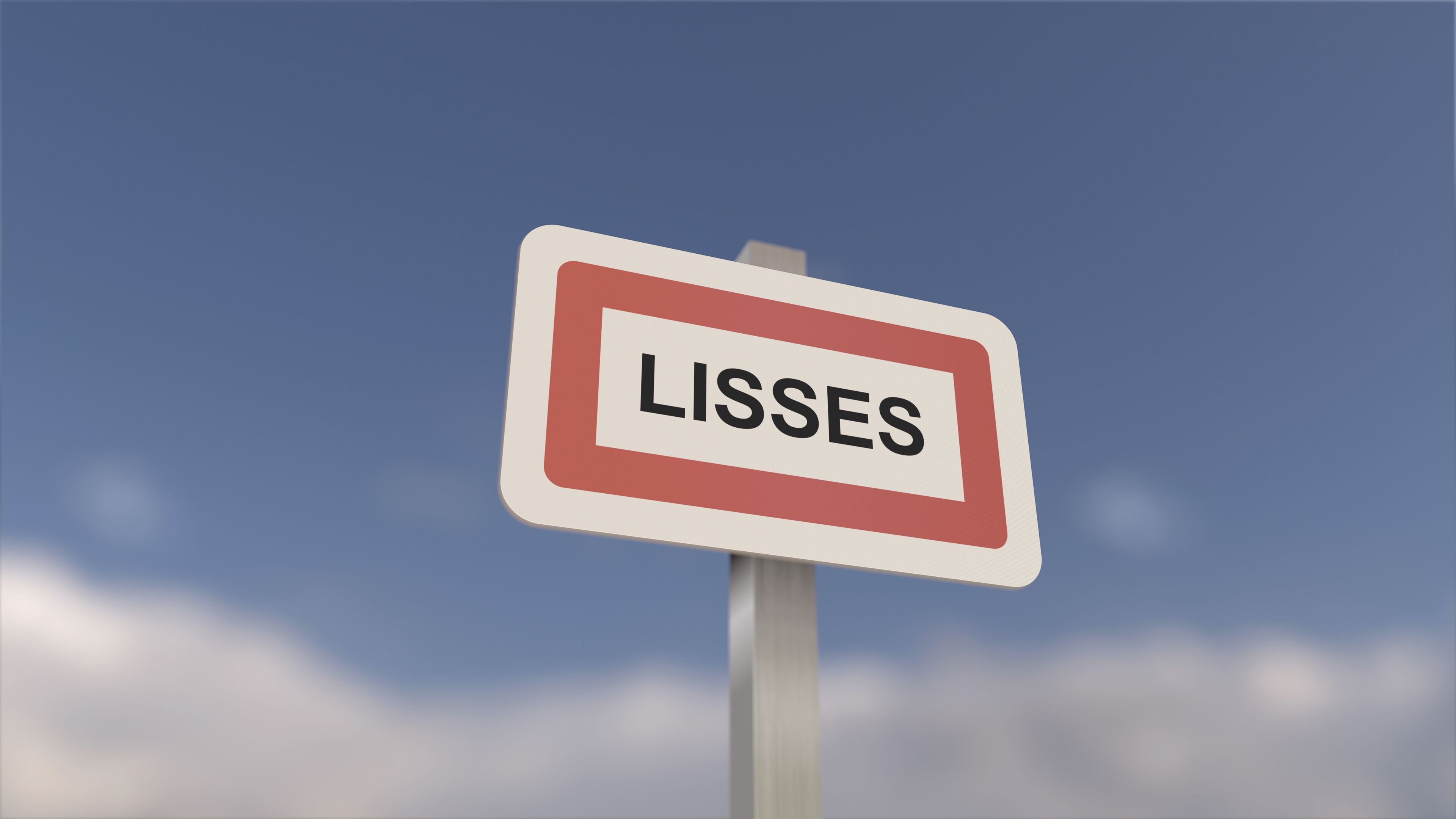A sign with the word 'LISSES' against a blue sky.