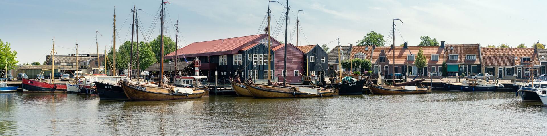 Old tradional fishing boats at the 'Havankade, (harbor quay) in the city of Elburg, Gelderland, NLD