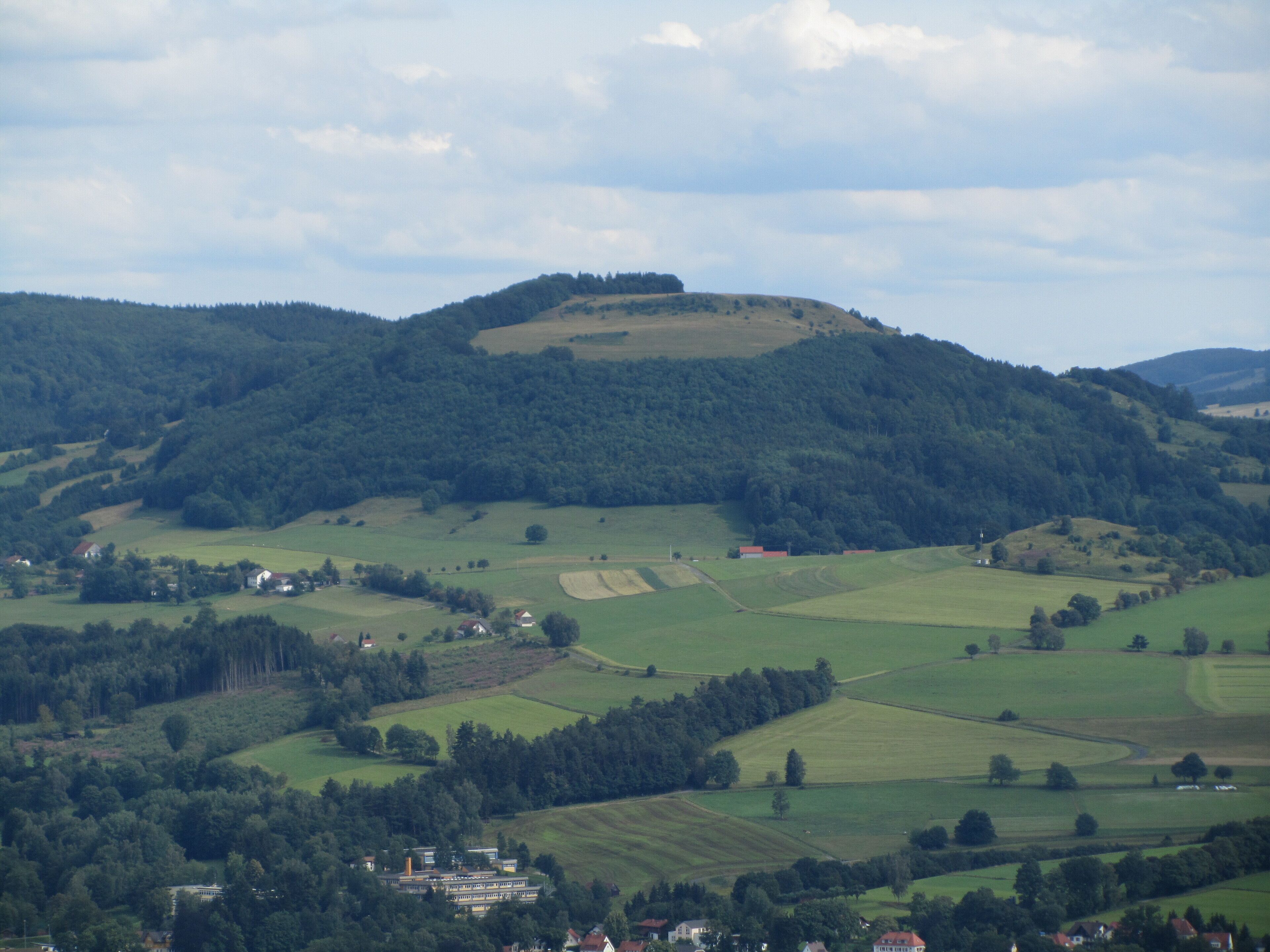 Rolling hills, a small village, and a large estate.