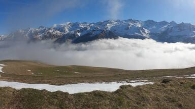 Snow and mountain peaks in the french Pyrenees near the Luchon Superbagnères Ski Resort in the Arrondissement of Saint-Gaudens, Occitania, Haute-Garonne, France. The Luchonnais Mountains aerial view.