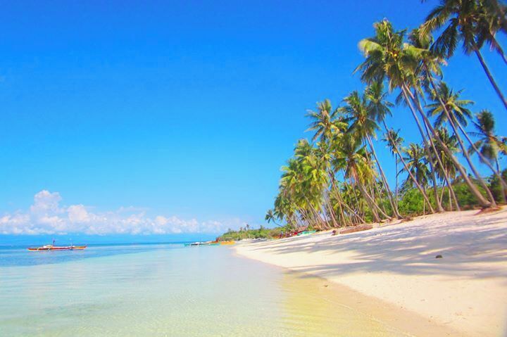 The inviting calm #blue waters is like a giant swimming pool in this public beach in Siquijor Island.