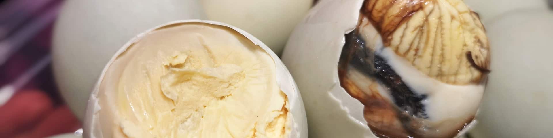 Balut is a 14 to 21-day old fertilized duck egg depending on how developed one wants the duck embryo is. Balut is a common street food that has its origins in China. Pateros is the balut-capital of the Philippines. Balut is boiled and then eaten with salt or some spiced vinegar. The way to eat balut: crack the shell, peel it bit by bit, slurp the soup (cooked amniotic fluid of the chick) before eating the egg and embryo. It is a favorite street food in the Philippines as it is cheap and nutritious. Another version for the less squimish is Penoy. It is an unfertized duck egg that is boiled. Depending on one's preference, it is just egg boiled with the consistency from runny to hard boiled - definitely no duck embryo on this one. (Left: Penoy / Right: Balut) #trovember #ItsMoreFunInThePhilippines