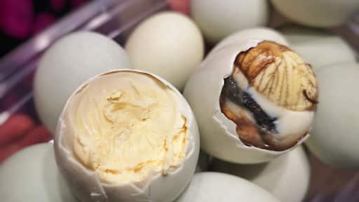 Balut is a 14 to 21-day old fertilized duck egg depending on how developed one wants the duck embryo is. Balut is a common street food that has its origins in China. Pateros is the balut-capital of the Philippines. Balut is boiled and then eaten with salt or some spiced vinegar. The way to eat balut: crack the shell, peel it bit by bit, slurp the soup (cooked amniotic fluid of the chick) before eating the egg and embryo. It is a favorite street food in the Philippines as it is cheap and nutritious. Another version for the less squimish is Penoy. It is an unfertized duck egg that is boiled. Depending on one's preference, it is just egg boiled with the consistency from runny to hard boiled - definitely no duck embryo on this one. (Left: Penoy / Right: Balut) #trovember #ItsMoreFunInThePhilippines