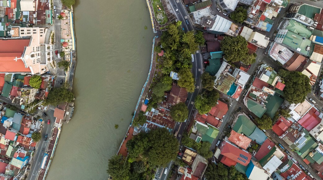 Top drone view of the Pasig River separating the cities of Mandaluyong and Makati, both part of Metro Manila.