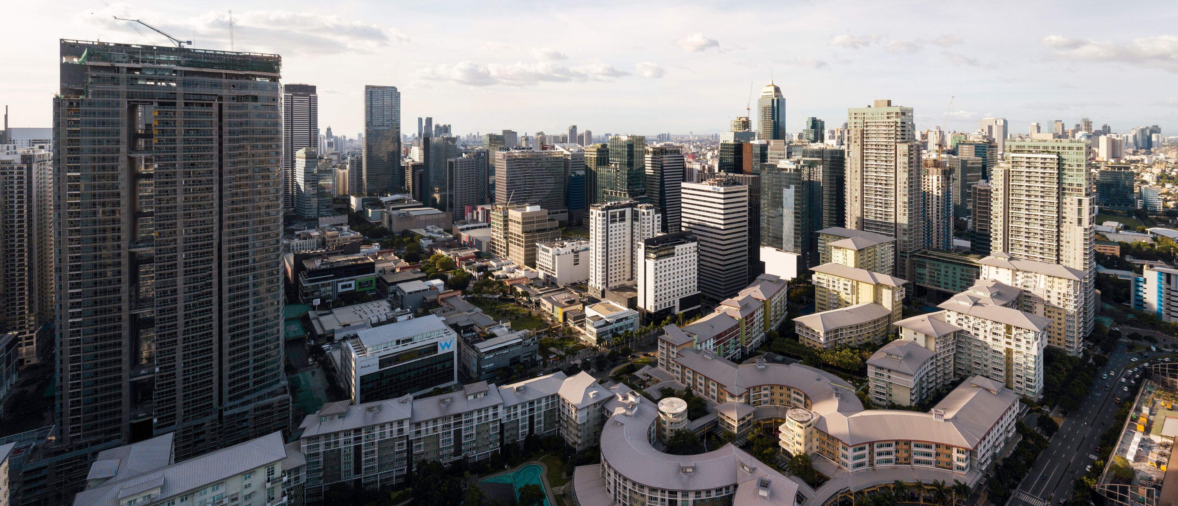 Fort Bonifacio, Metro Manila, Philippines - Aerial of Bonifacio High Street and Serendra, flanked by taller skyscrapers on each side. Beautiful urban zoning.