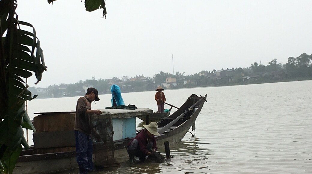 Villagers of Sinh Village washing their fishing nets