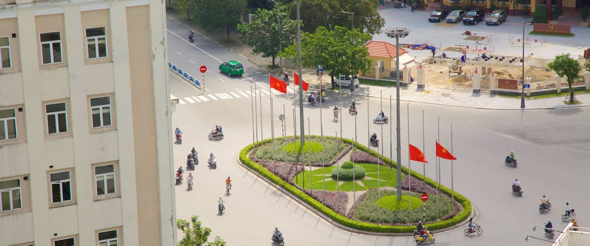 Hue City Centre featuring a garden and motorbike riding as well as a small group of people