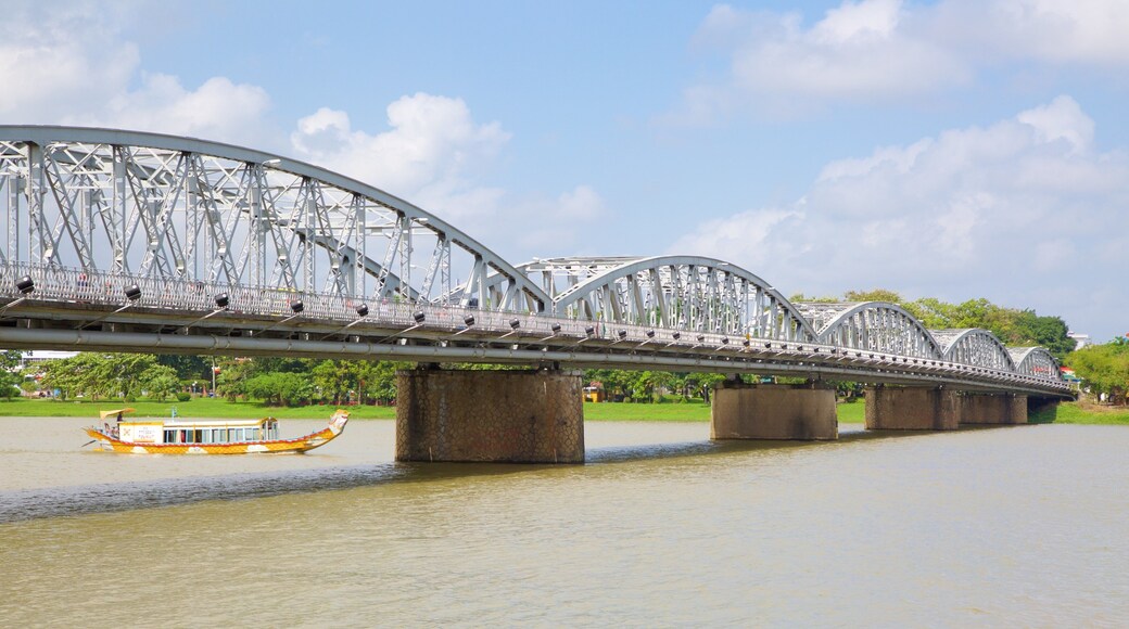 Thanh Toan Bridge featuring a river or creek, a bridge and boating