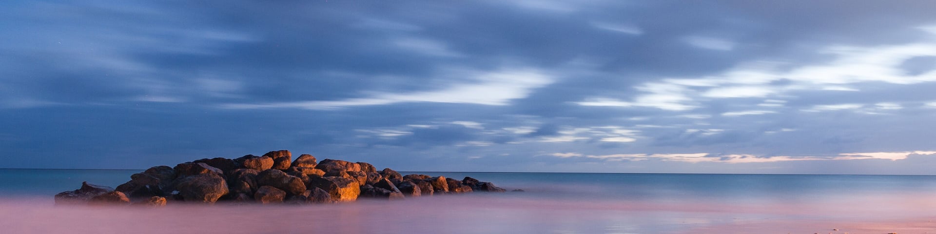 Beach in Barbados. Long Exposure. Caribbean Sea and Flowing Sky