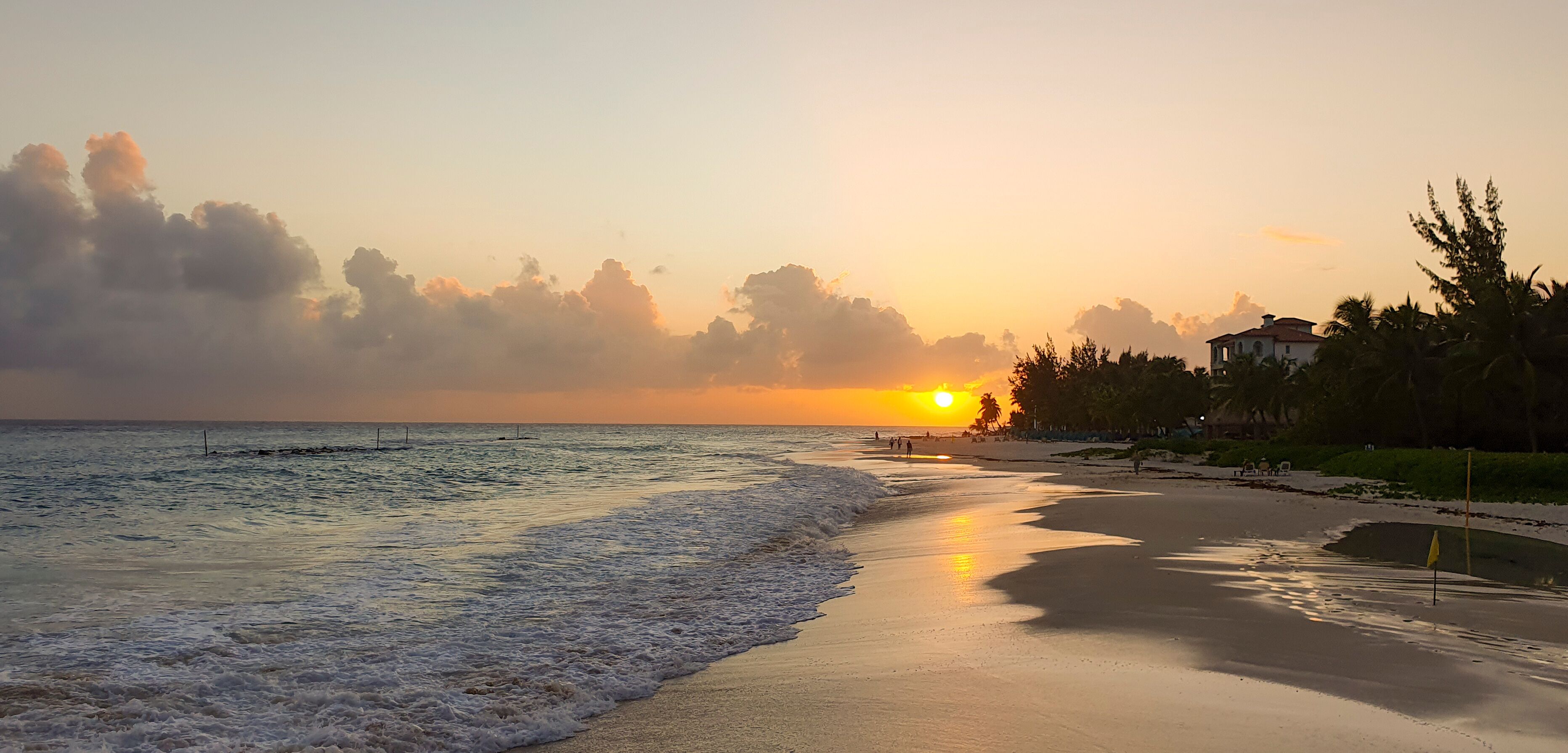 Sunset on Maxwell beach Barbados, in the evening.