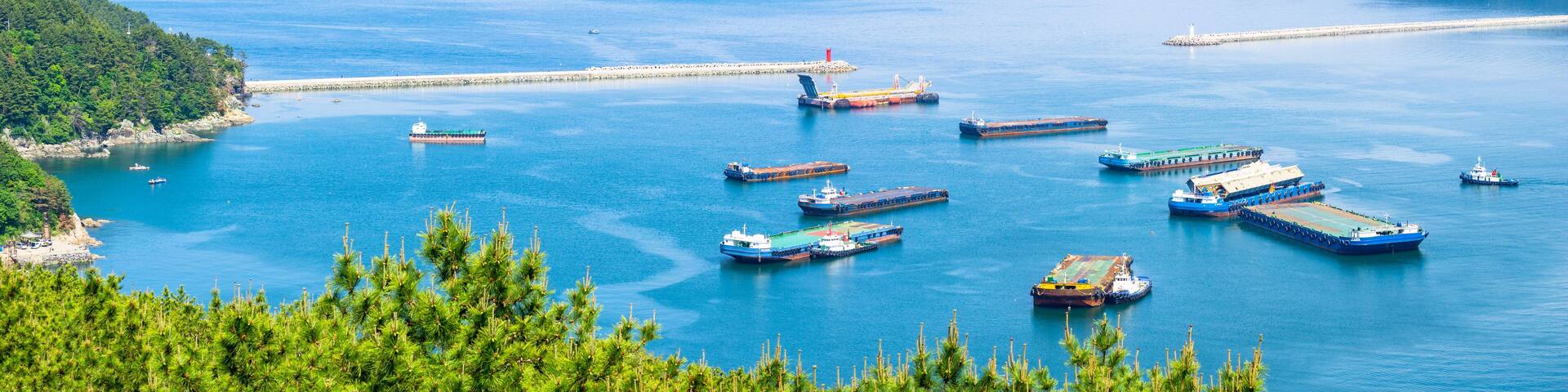 GEOJE ISLAND, SOUTH KOREA - MAY 13, 2018 : Mouth of the Bay of Daewoo Shipbuilding and Marine Engineering (DSME) in Okpo city, The bay consists of many kind of ships in marine engineering Industries.