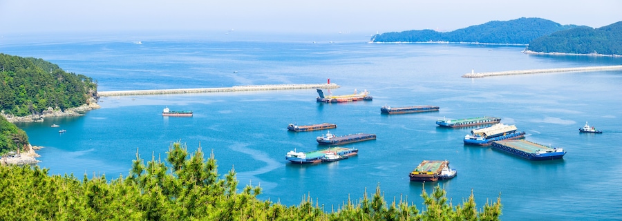 GEOJE ISLAND, SOUTH KOREA - MAY 13, 2018 : Mouth of the Bay of Daewoo Shipbuilding and Marine Engineering (DSME) in Okpo city, The bay consists of many kind of ships in marine engineering Industries.