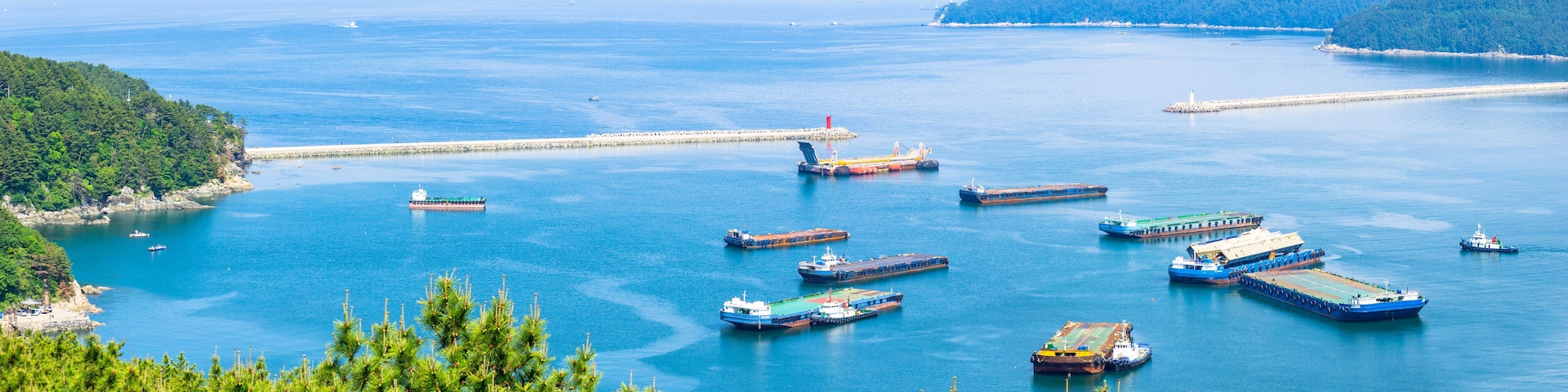 GEOJE ISLAND, SOUTH KOREA - MAY 13, 2018 : Mouth of the Bay of Daewoo Shipbuilding and Marine Engineering (DSME) in Okpo city, The bay consists of many kind of ships in marine engineering Industries.