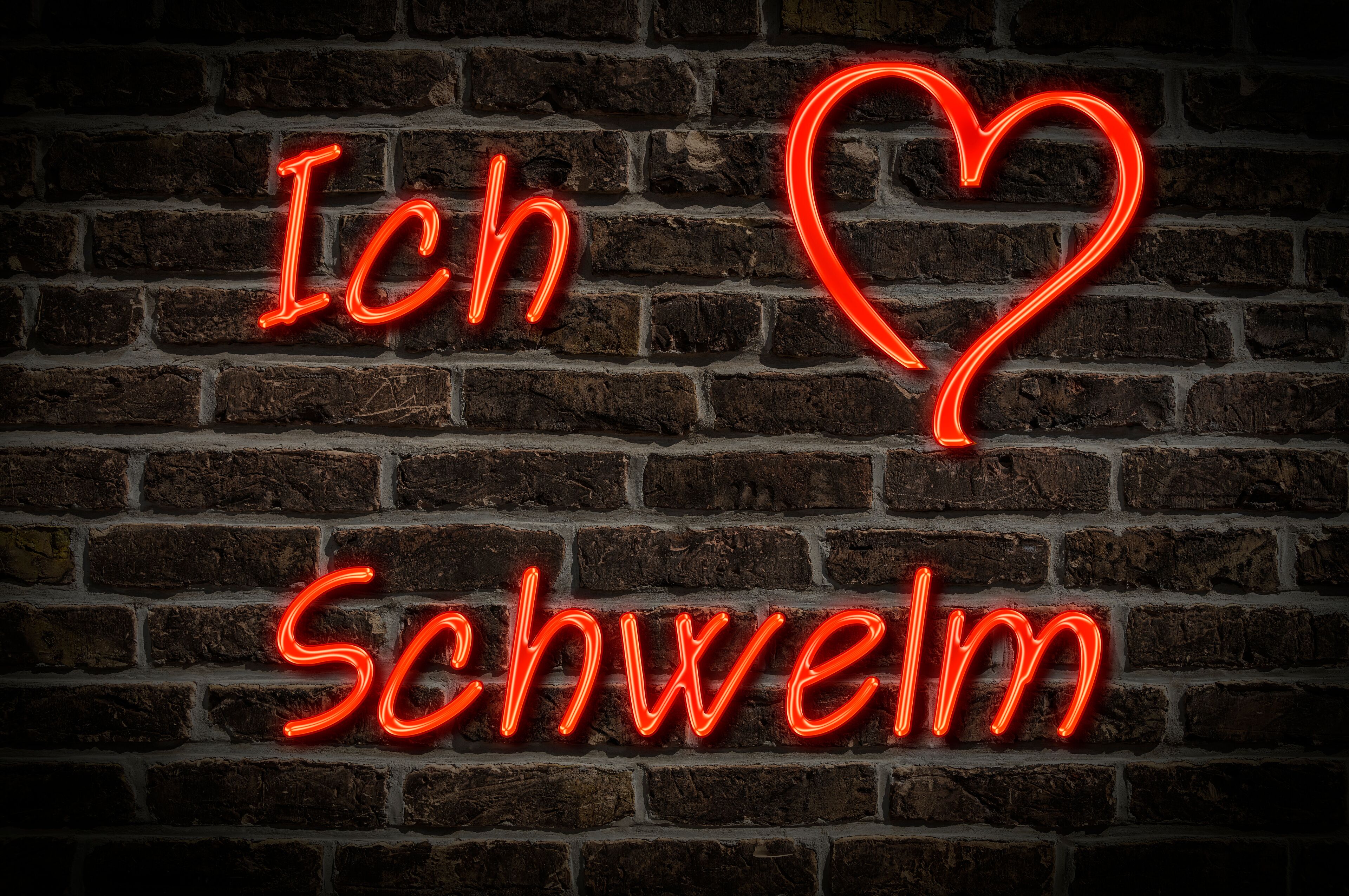 A neon sign spelling "Ich Schweim" on a brick wall.
