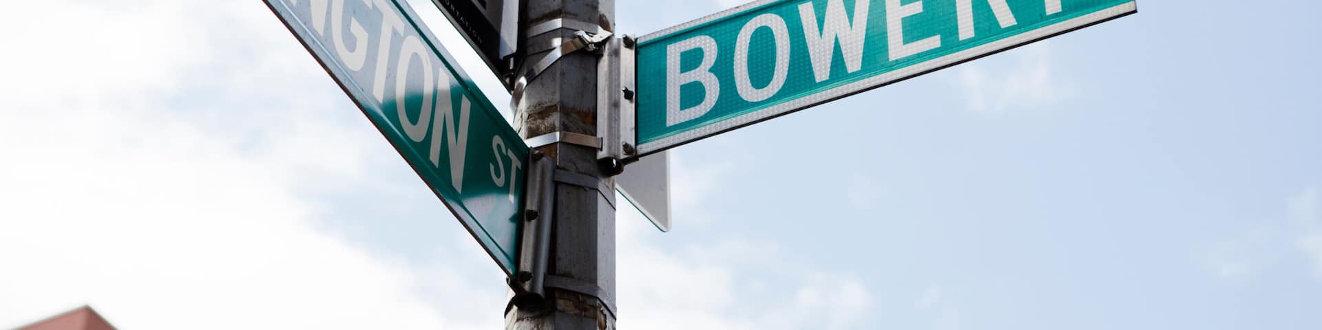 Street signs for RIVINGTON ST and BOWERY.