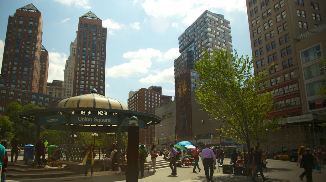 Union Square Park in New York showcases vibrant activity and urban architecture under a sunny sky