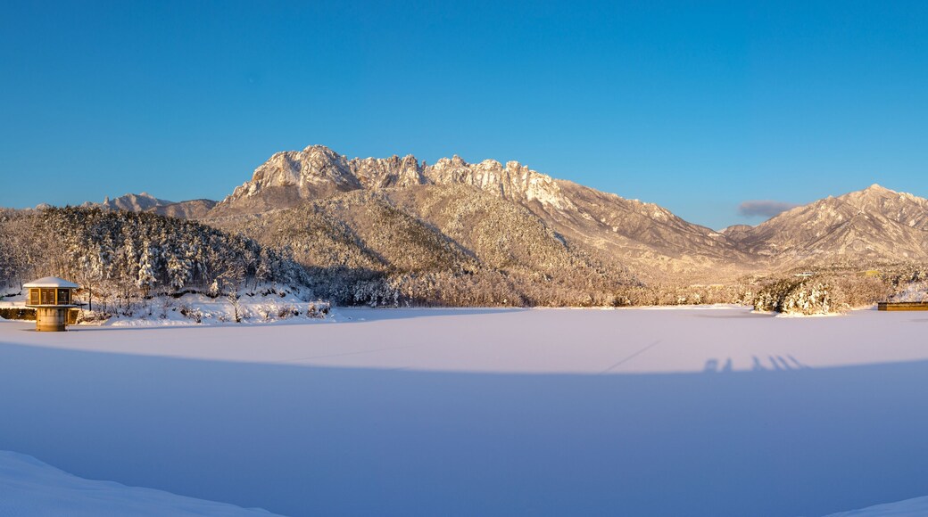Panoramic and morning view of snow covered Wonam Reservoir with the background of Ulsanrock of Seoraksan Mountain near Goseong-gun, South Korea