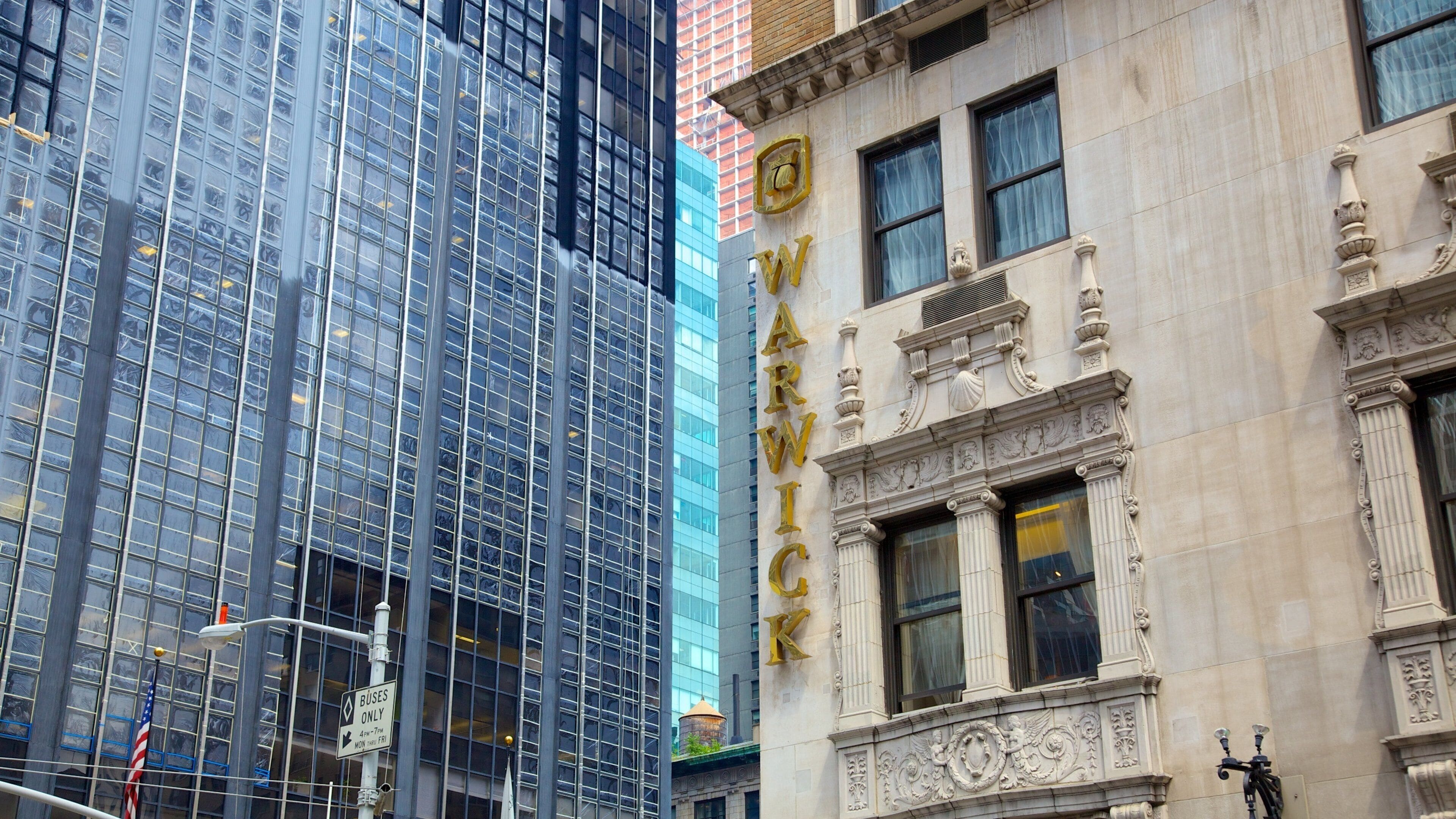 5th Avenue showing a city, signage and modern architecture