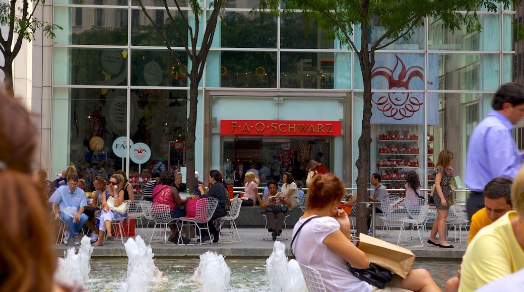 5th Avenue which includes a fountain, outdoor eating and signage