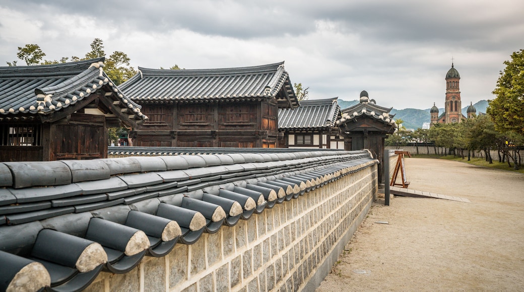 Gyeonggijeon shrine buildings and Jeondong Francis Xavier cathedral an old catholic church in background Jeonju South Korea