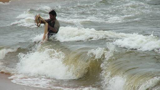 Fishing off the beach at waikkal