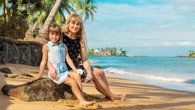 Child girl on the beach with her mother. Selective focus.