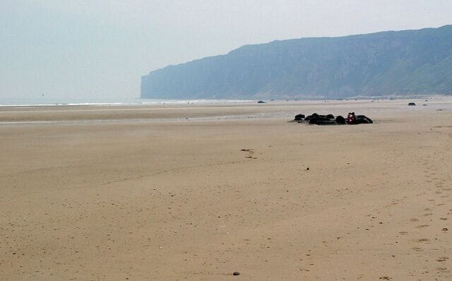 Speeton Sands, Speeton, North Yorkshire, England. Looking southeast Bempton Cliffs, Bempton, East Riding of Yorkshire, form the headland, Flamborough being hidden "round the corner".