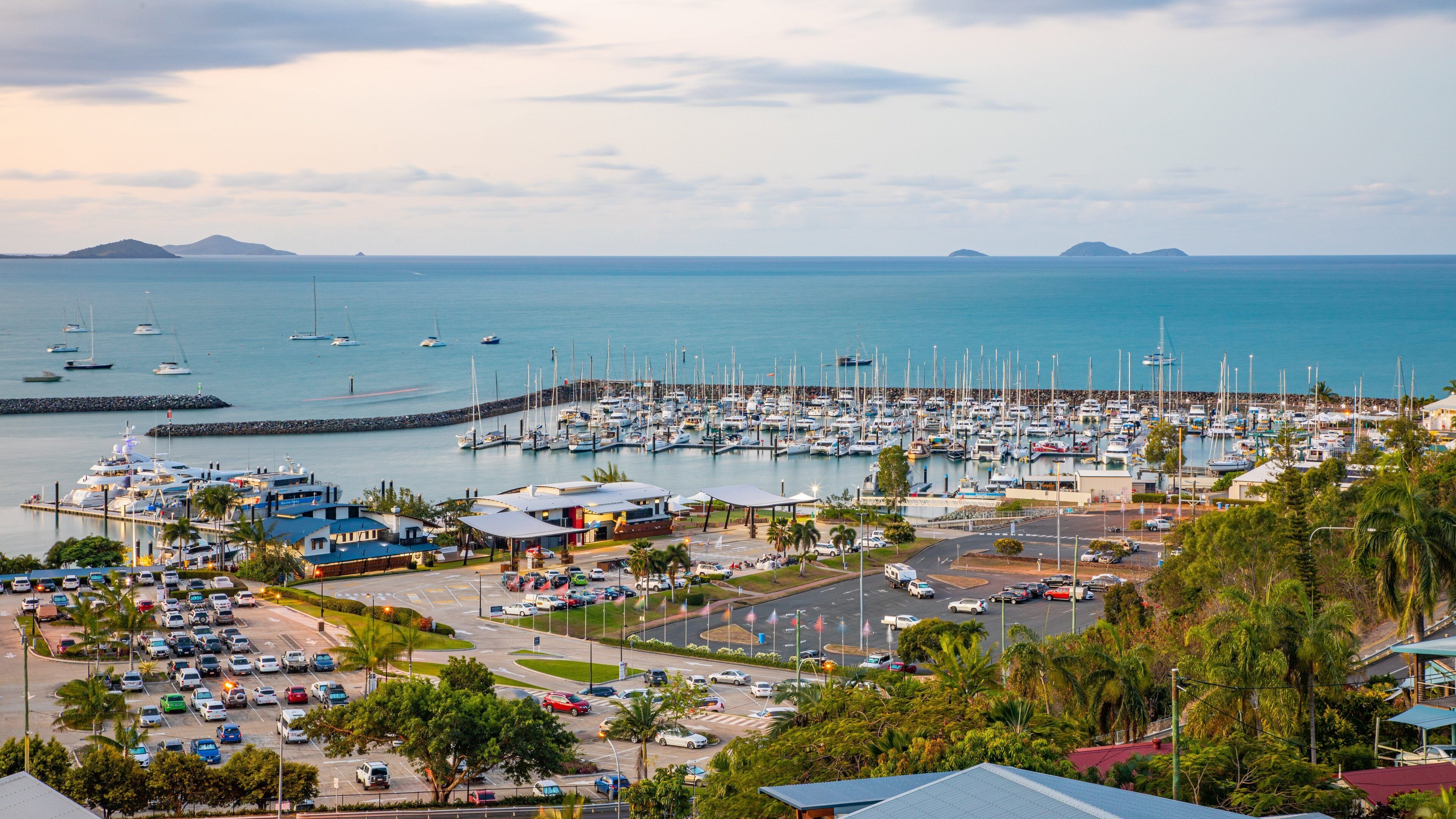 Coral Sea Marina featuring general coastal views, a bay or harbor and a sunset