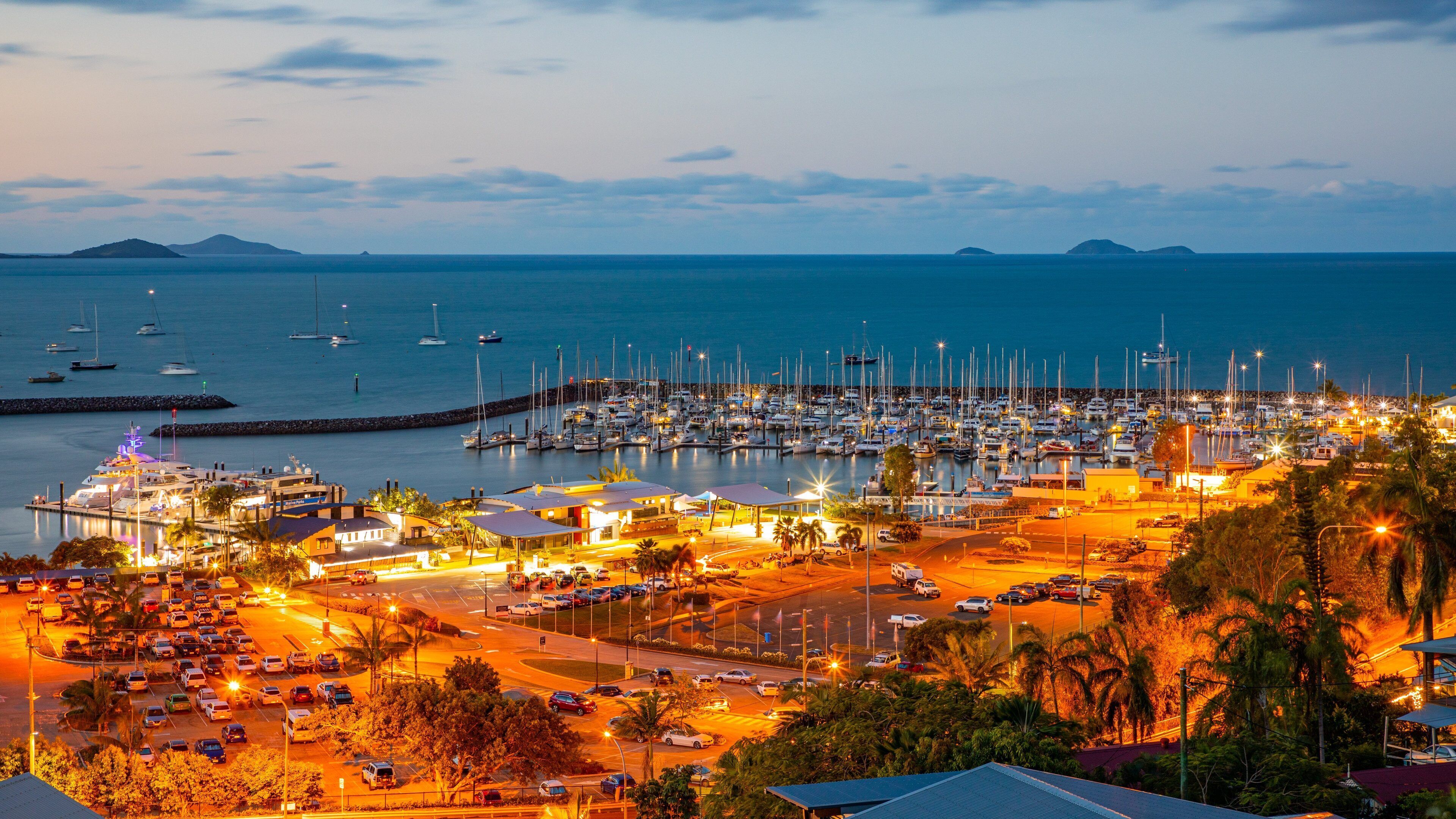Coral Sea Marina which includes general coastal views, landscape views and night scenes