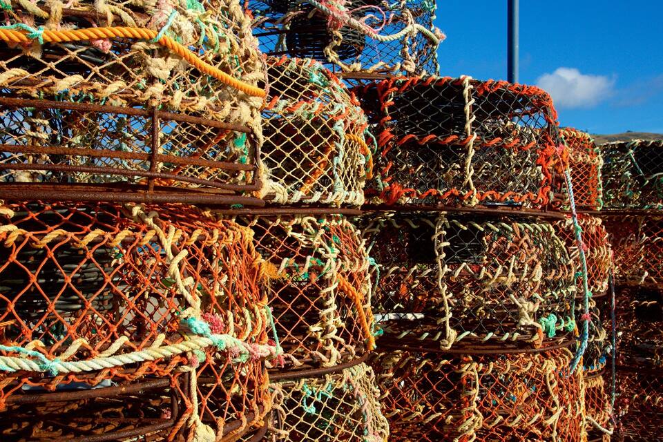 Stacks of colorful lobster traps.