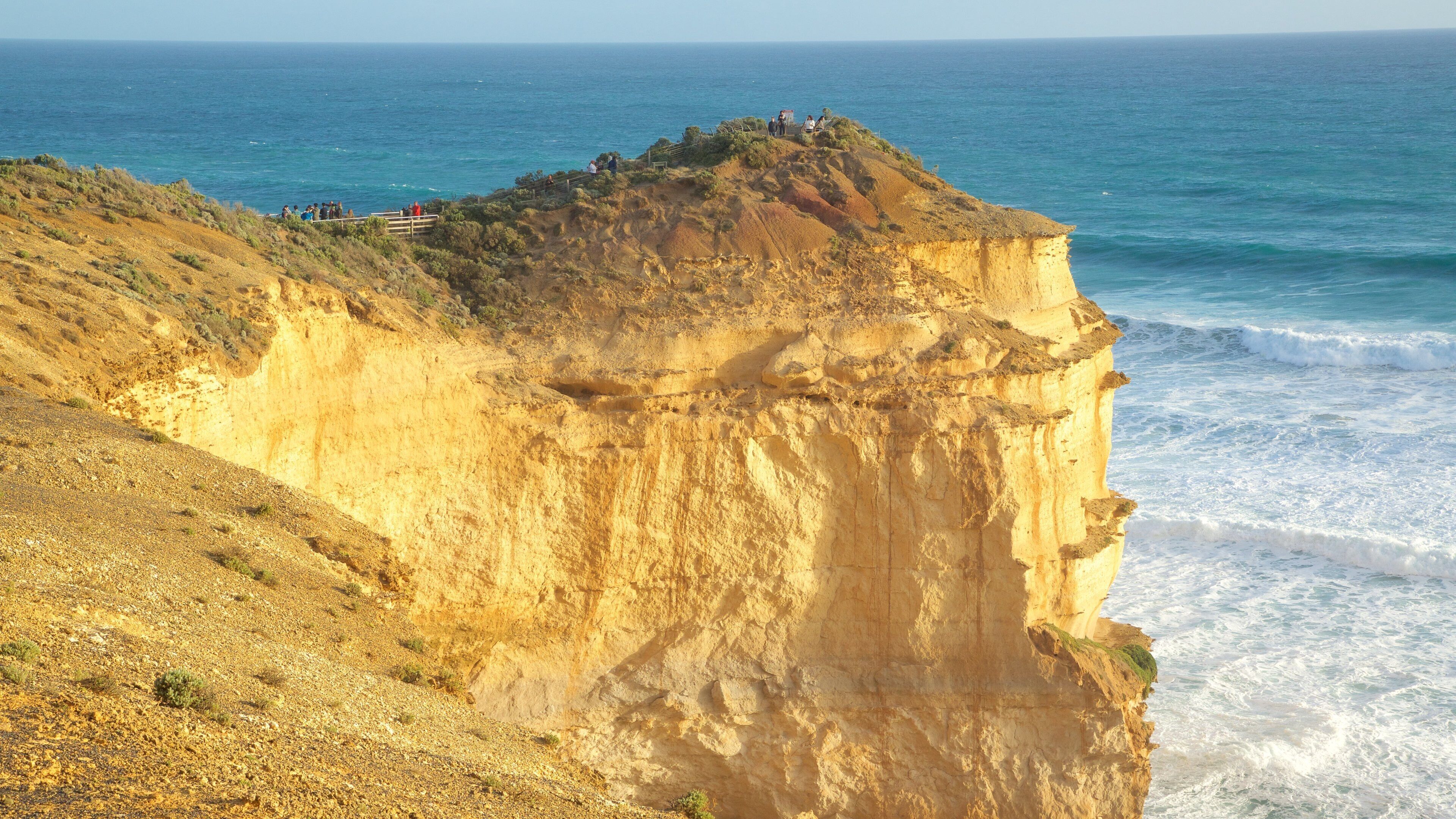 The Twelve Apostles showing rocky coastline and a gorge or canyon