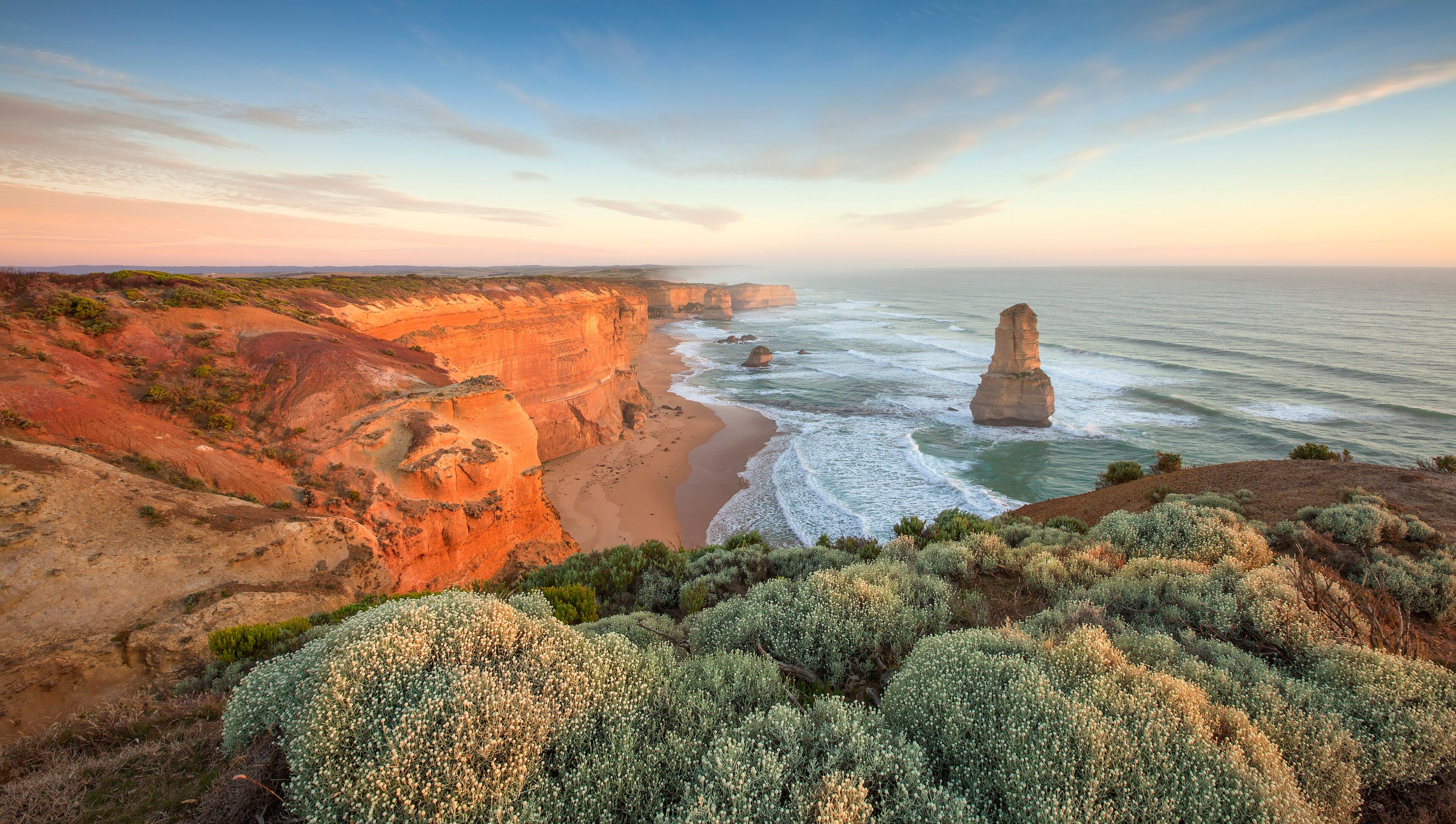 Great Ocean Road is home to the world class surf at Bells Beach and the craggy limestone spires of the Twelve Apostles